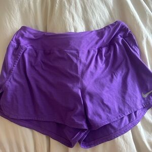 Nike running shorts in wild berry